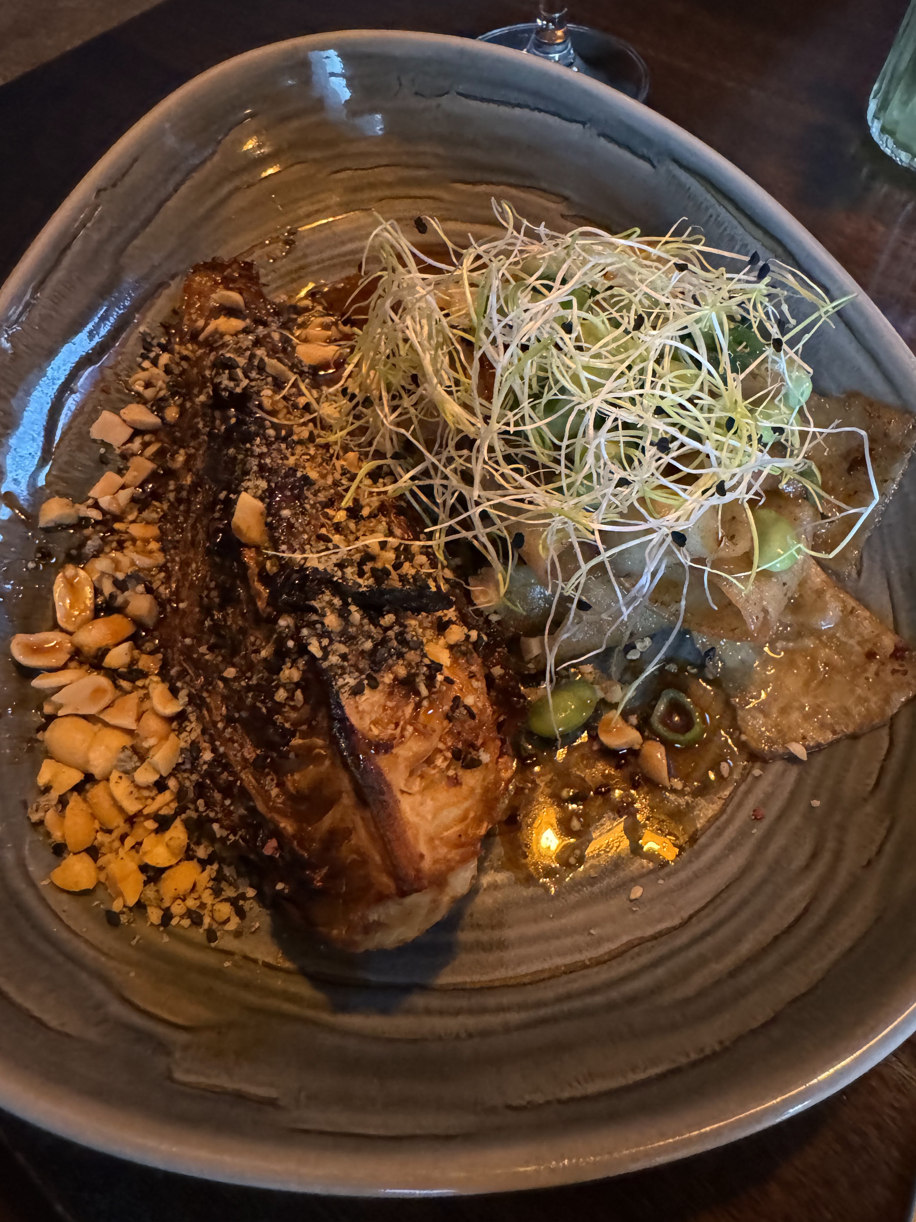 Charred greens with toasted peanuts, sprouts and edamame